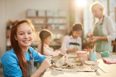 Child enjoying using her creative kids voucher