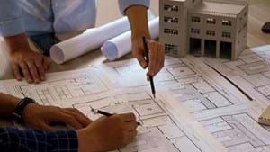 architect discussing possible alterations to apartment plans